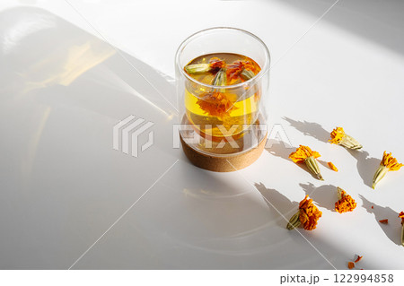 Glass of Wholesome Marigold Herbal Tea. Glass of Wholesome Marigold Herbal Tea. 122994858