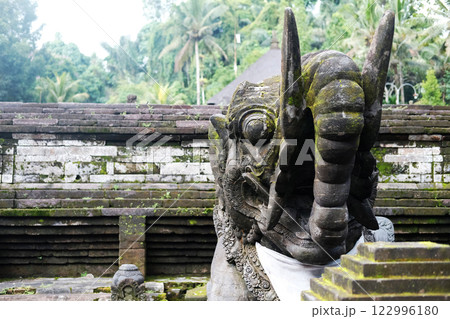 Ancient elephant stucco statue is god and belief in Hindu with religion and culture decorated outdoor front arched entrance in Bali, Indonesia Ancient elephant stucco statue is god and belief in Hindu with religion and culture decorated outdoor front arched entrance in Bali, Indonesia 122996180