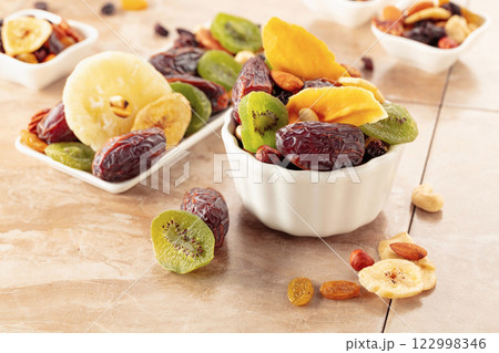 Dried tropical fruits with various nuts and raisins. 122998346