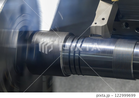 The CNC lathe machine forming  cutting the metal shaft parts. 122999699