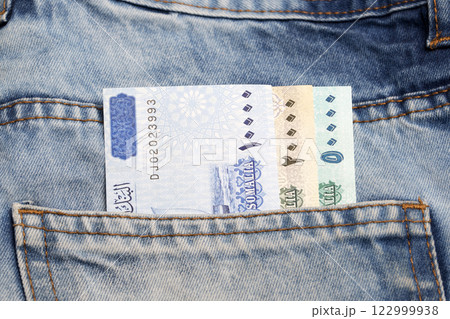 Somali Shilling  in the pocket of blue jeans 122999938