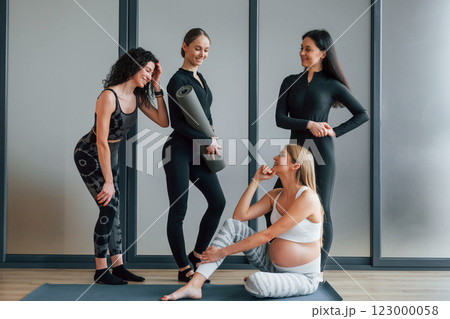 Women in sportive clothes standing in the fitness center 123000058