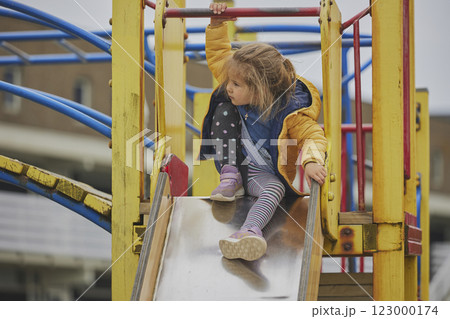 Charming child playing on a playground in Ringkobing Denmark Charming child playing on a playground in Ringkobing Denmark 123000174