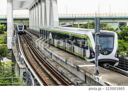 A Green Line train running on the elevated track of the Taichung Rapid Transit System in Taiwan.  123001665