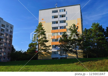 Original prefabricated houses on a housing estate from the communist era in Eastern and Central Europe after reconstruction.. Facade of a modern apartment building with windows and balconies. Czech Original prefabricated houses on a housing estate from the communist era in Eastern and Central Europe after reconstruction.. Facade of a modern apartment building with windows and balconies. Czech 123001847