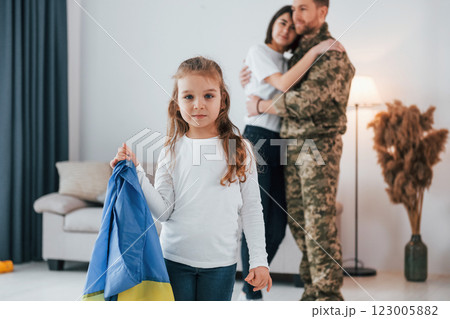Ukrainian's hard times. Soldier in uniform is at home with his wife and daughter Ukrainian's hard times. Soldier in uniform is at home with his wife and daughter 123005882