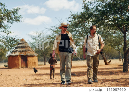 Tourists is in Namibia with African kids 123007460