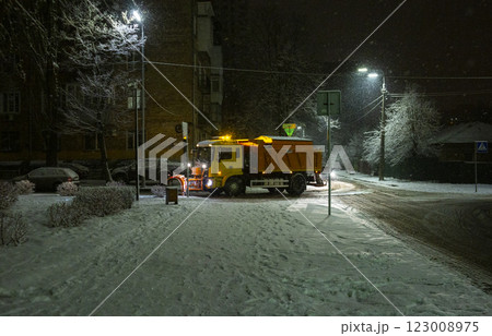 snow removal machine on the evening street snow removal machine on the evening street 123008975