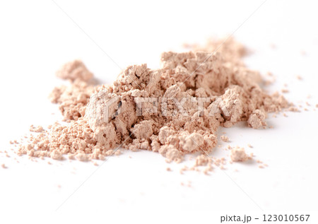 A sample of dry cosmetic clay for a mask or cosmetic powder. White background A sample of dry cosmetic clay for a mask or cosmetic powder. White background 123010567
