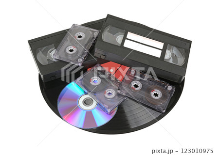 Compact disc, vinyl disc, audio and video cassettes isolated on white Compact disc, vinyl disc, audio and video cassettes isolated on white 123010975