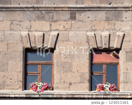 windows with flower pots on tuff facade of house windows with flower pots on tuff facade of house 123011161