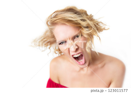 Closeup portrait of angry shouting woman isolated at white background. Concept of stress, agressive behavior and relationship conflict. Closeup portrait of angry shouting woman isolated at white background. Concept of stress, agressive behavior and relationship conflict. 123011577