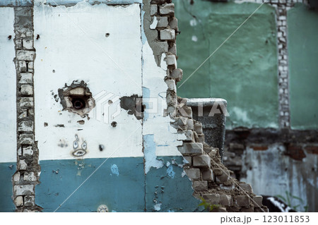 Closeup image of a dirty ruined bricks wall of a building with cracks, holes. 123011853