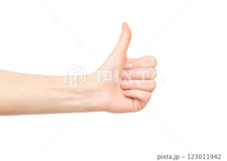 Female hand with thumb up gesturing success isolated at white background. Female hand with thumb up gesturing success isolated at white background. 123011942
