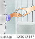 Two hands are reaching out to each other, nearly touching, against a backdrop of soft, muted colors. Two hands are reaching out to each other, nearly touching, against a backdrop of soft, muted colors. 123012437