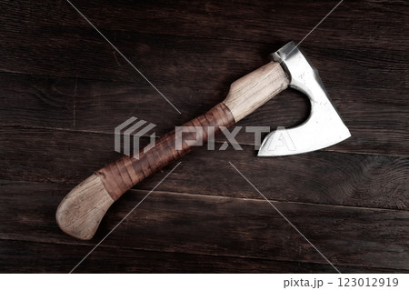 battle axe with wooden handle on white 123012919