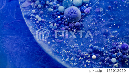 Multicolored emulsion. Oil bubbles. Blue violet liquid texture mixing with gel drops. Paint smooth wave abstract art water background. 123012920