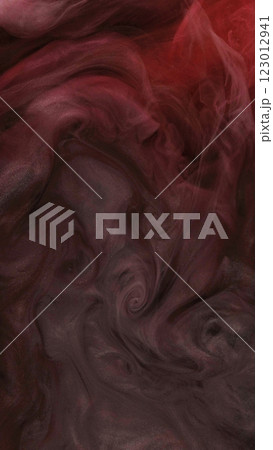 Color burst. Paint glitter explosion. Defocused red glowing splashes ink texture haze on golden abstract art dark background. 123012941