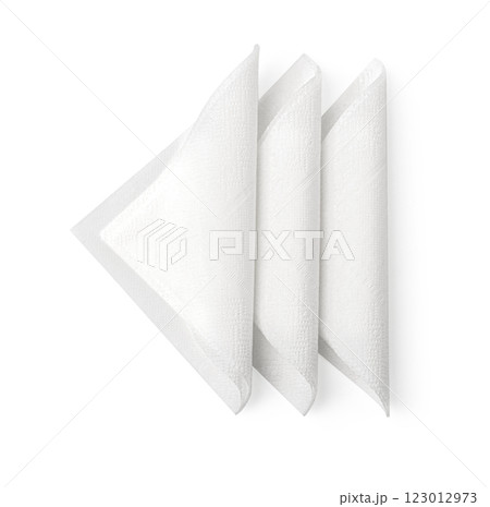 Three white folded paper napkins isolated on white background 123012973