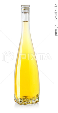 Full glass bottle of white wine on white background reflecting light Full glass bottle of white wine on white background reflecting light 123013012