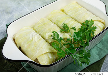 raw cabbage rolls, not cooked, with minced meat, top view, without people, in the spotlight. 123013216