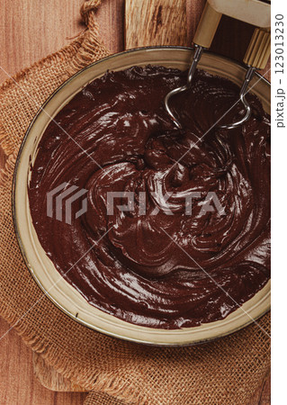 a bowl of chocolate dough , a whisk for a mixer, baking, structure and consistency, homemade, top view, no people, 123013230