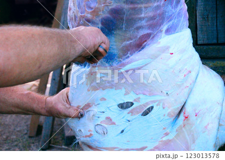 Butcher carving goat carcass. Fresh meat 123013578