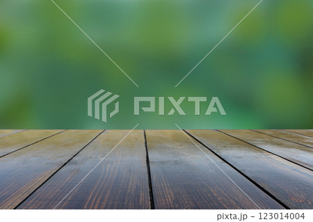 Old wooden stand with view of blurred green background. Vintage stand 123014004