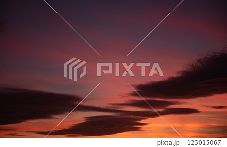 Radiant Sunset Sky with Vibrant Cloudscape 123015067