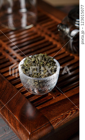 An Elegant Presentation of Tea Loose Leaf Green Tea Displayed Beautifully in a Glass Bowl An Elegant Presentation of Tea Loose Leaf Green Tea Displayed Beautifully in a Glass Bowl 123015077