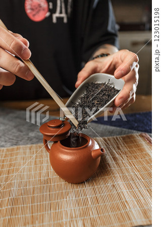The Art of Tea Preparation Using a Traditional Teapot and Loose Tea Leaves for Best Results 123015198