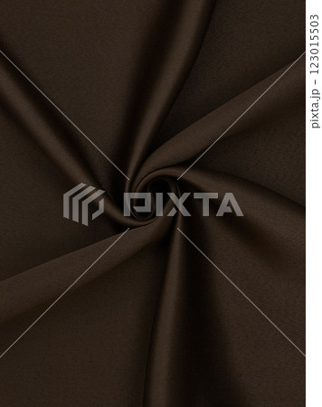 Close-up of twisted brown curtain fabric texture in smooth folds 123015503