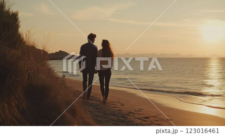Couple walking on the beach at sunset. 123016461