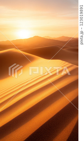 Golden sand dunes at sunset with soft shadows and warm light Golden sand dunes at sunset with soft shadows and warm light 123019891