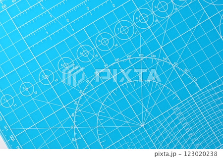 blue cutting mat board background with line and scale measure guide pattern for object art design 123020238