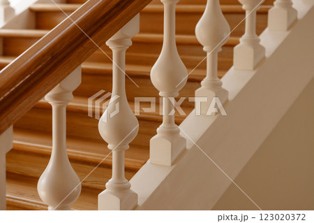 Luxurious wooden staircase with white balusters. Luxurious wooden staircase with white balusters. 123020372