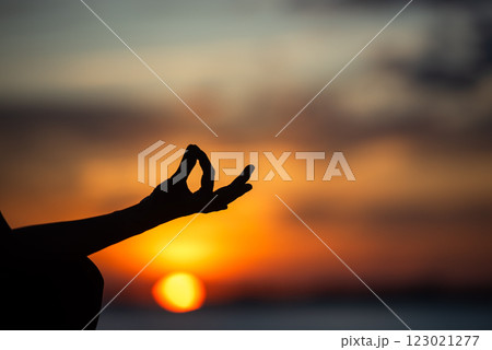 Close up hands Silhouette lifestyle woman yoga exercise for healthy life 123021277