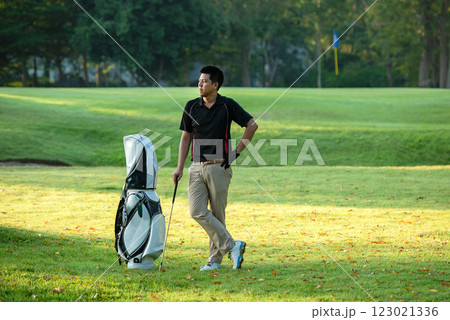 Golfer sport course golf ball fairway. People lifestyle man approach playing game golf tee off on the green grass. Golfer sport course golf ball fairway. People lifestyle man approach playing game golf tee off on the green grass. 123021336
