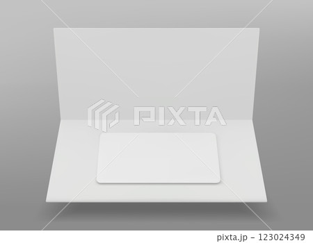 White plastic gift card in folded paper package. 123024349