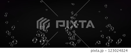 Fizzy water bubbles floating on dark background. 123024824