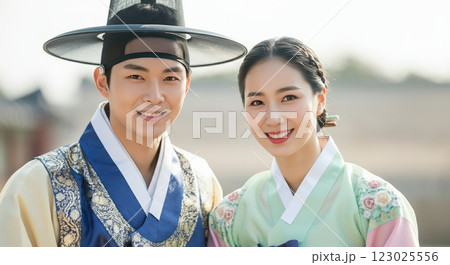 Traditional korean hanbok attire with smiling asian couple celebrating cultural heritage 123025556