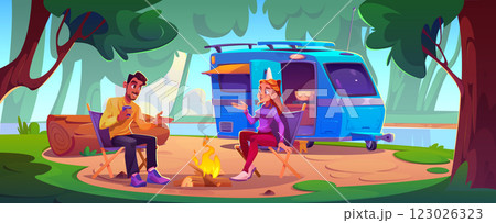 People enjoy outdoor recreation near motorhome People enjoy outdoor recreation near motorhome 123026323