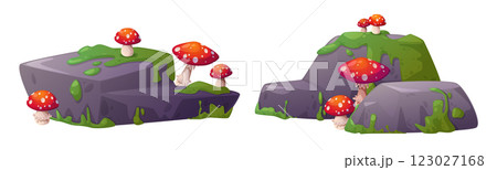 Bright red spotted mushrooms on mossy swamp stones 123027168