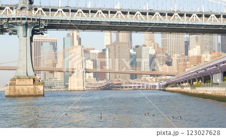 New York City Manhattan Bridge to Brooklyn. Waterfront downtown skyline cityscape, river Pier 35. New York City Manhattan Bridge to Brooklyn. Waterfront downtown skyline cityscape, river Pier 35. 123027628