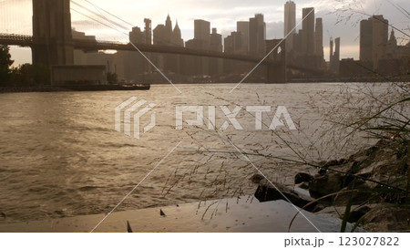 Brooklyn Bridge, Dumbo, rainy foggy day. New York City Manhattan downtown skyline. World Trade Center Brooklyn Bridge, Dumbo, rainy foggy day. New York City Manhattan downtown skyline. World Trade Center 123027822