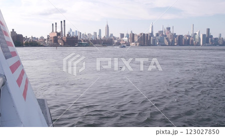 New York City skyline from ferry boat. Manhattan midtown, Empire State, Chrysler Building, USA. New York City skyline from ferry boat. Manhattan midtown, Empire State, Chrysler Building, USA. 123027850
