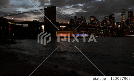 Brooklyn Bridge, Dumbo carousel. New York City Manhattan downtown skyline. Dramatic twilight dusk. 123027963