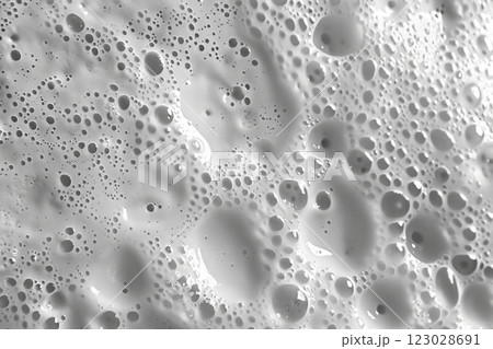 White foamy texture in motion top view. Cosmetic facial skin cleanser, shower gel, shaving foam background. Creamy cleansing skincare product bubbles. Soapy substance. Bubble backdrop. Washing liquid 123028691