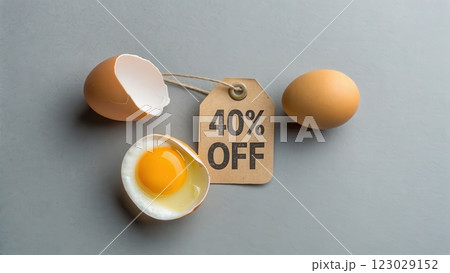 Cracked Egg with 40 Off Price Tag on Minimalist Gray Background 123029152