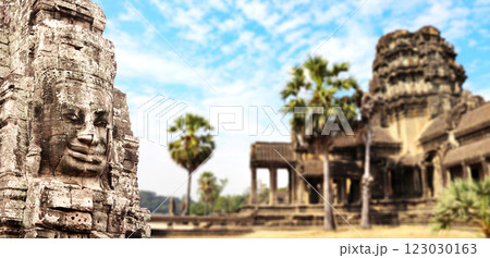 Horizontal banner with stone face in Prasat Bayon Temple. Famous landmark Angkor Wat complex, khmer culture, Siem Reap, Cambodia. Topic of vacation, travel, trip abroad on vacation, cruises and tours Horizontal banner with stone face in Prasat Bayon Temple. Famous landmark Angkor Wat complex, khmer culture, Siem Reap, Cambodia. Topic of vacation, travel, trip abroad on vacation, cruises and tours 123030163